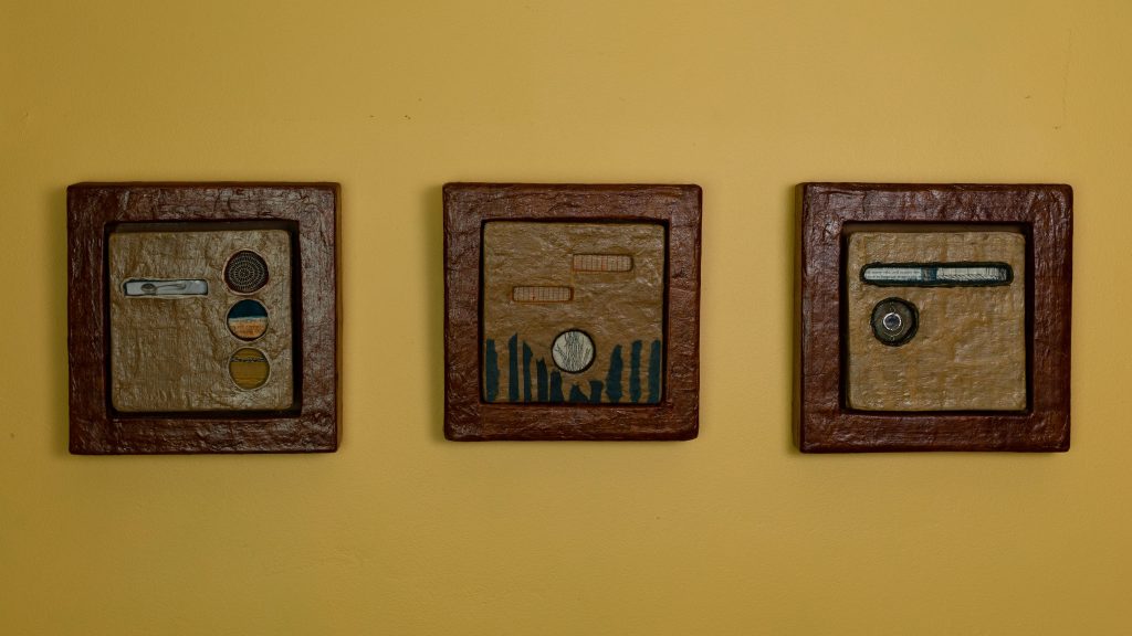 Three cardboard art sculptures.